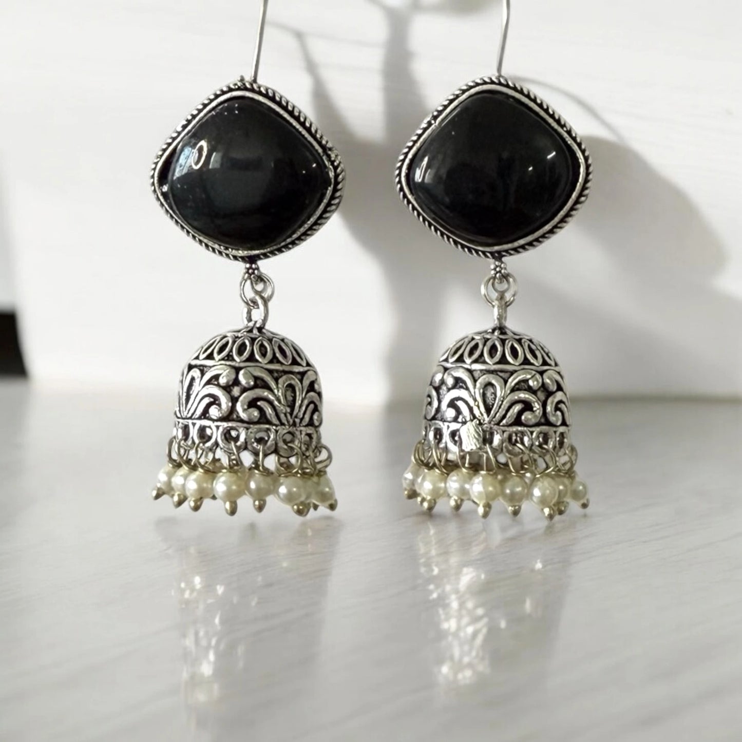 Elegant Black Stone Jhumka Earrings with Silver Detailing and Pearl Drops - Perfect for Weddings & Festive Occasions