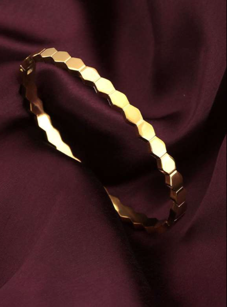 Geometric gold bangle with a hexagonal design