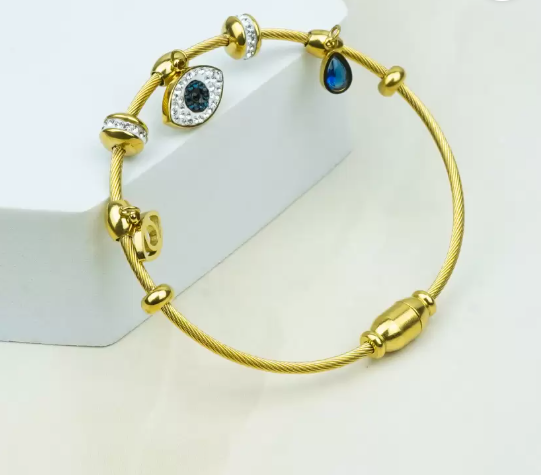 Gold Evil Eye Charm Bracelet with Diamond and Sapphire Accents
