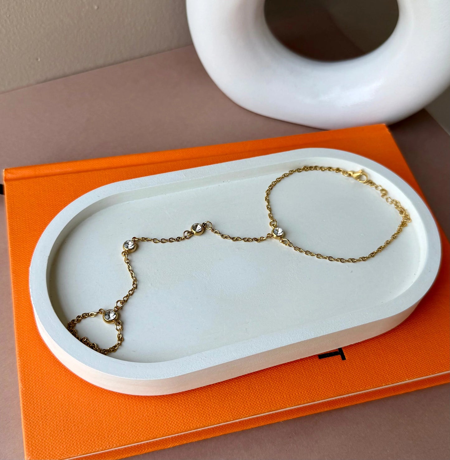 Gold Hand Chain with Crystal Accents – Elegant and Stylish Jewelry Piece