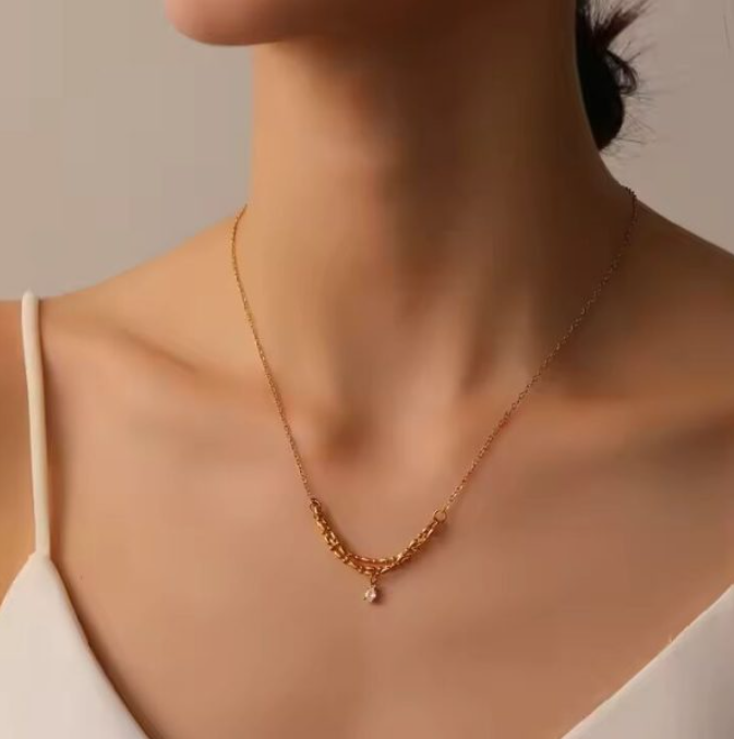 Gold-plated crystal pendant necklace on a layered chain — alternate view