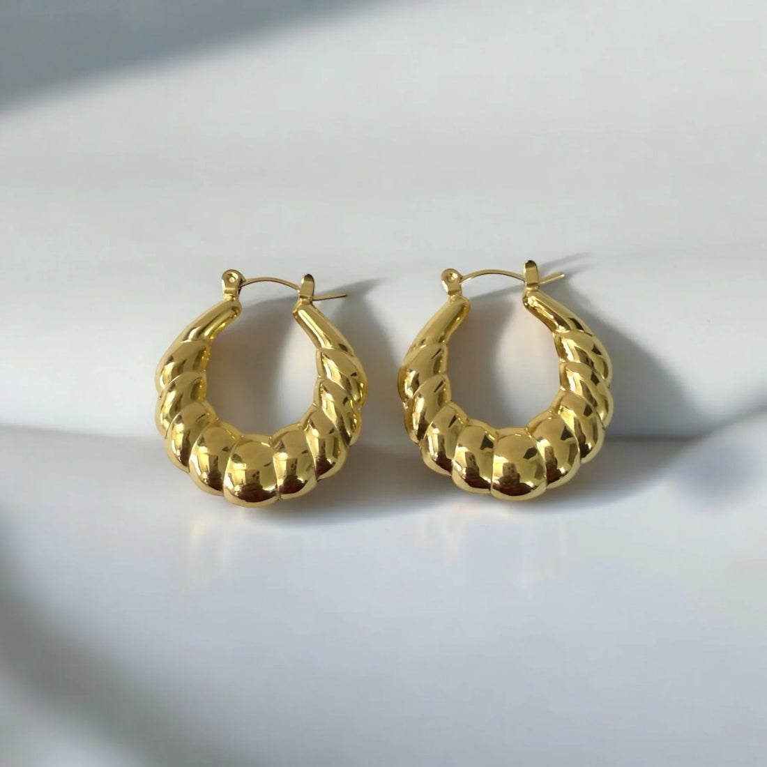 Bold twisted gold-tone hoop earrings