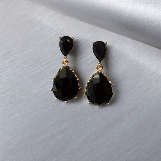 Black teardrop dangle earrings with gold accents