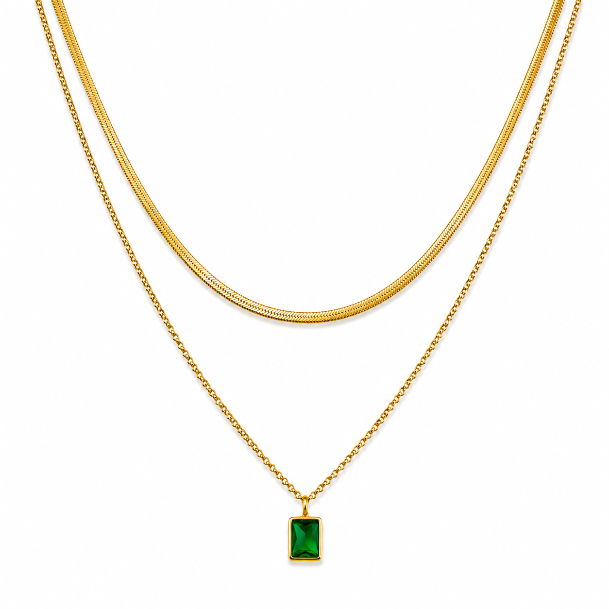 Gold layered necklace set with snake chain and green gem pendant