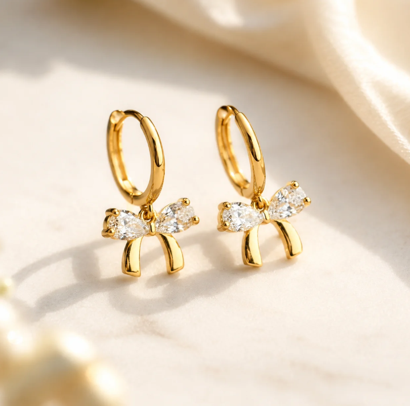 Gold-plated bow earrings with crystal detail — alternate view