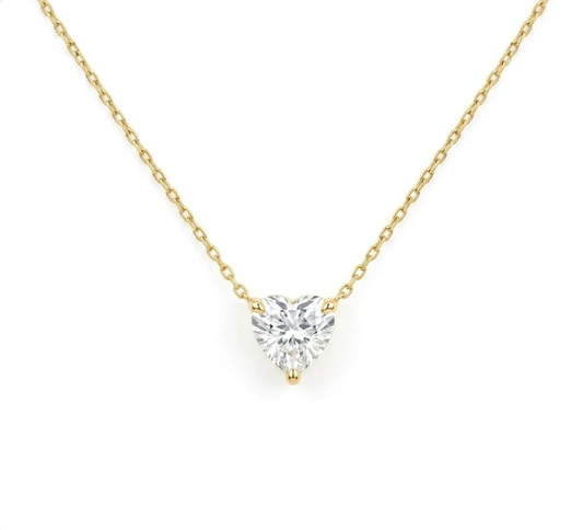 Gold necklace with a white crystal pendant
