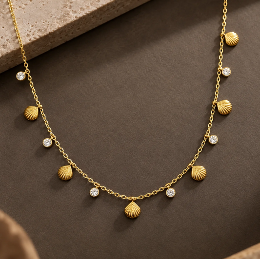 Gold seashell and crystal charm necklace